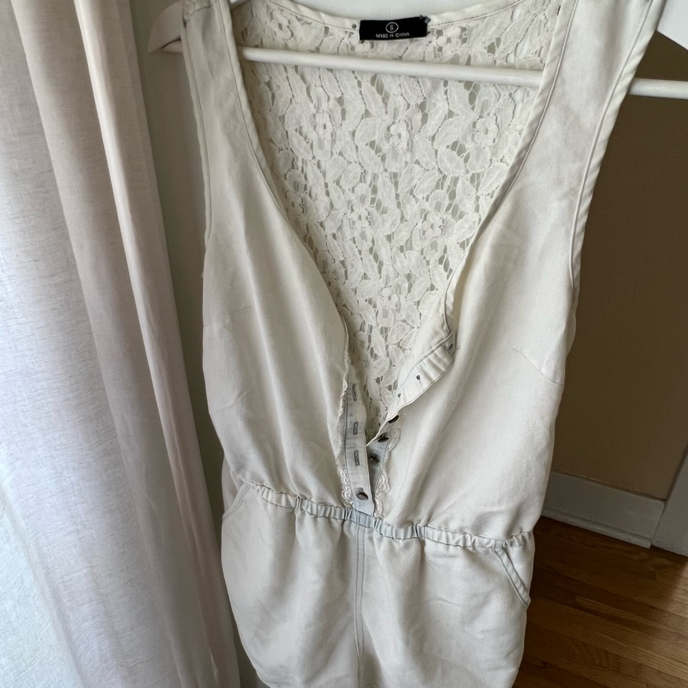 Light denim button up romper with lace size S